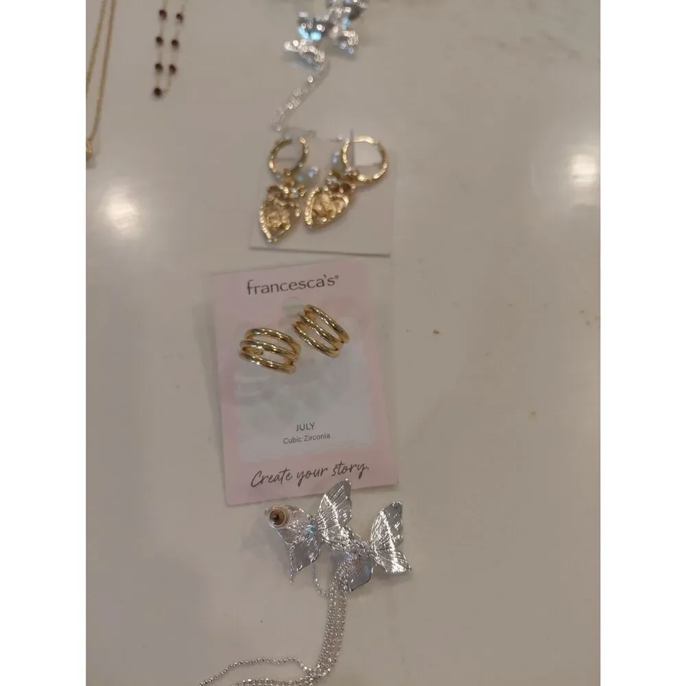 4 sets of earrings, 4 bracelets, and 7 necklaces which are all new.